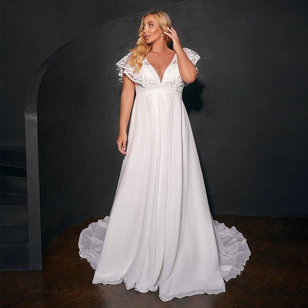 V-neck empire waistline with short sleeves. Made in beautiful soft flowing white or ivory chiffon sizes 2-26