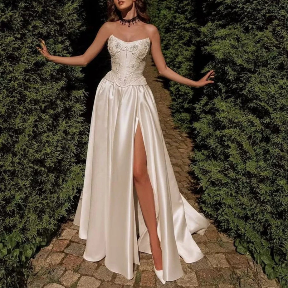 Ivory a-line luxurious satin fabric with a strapless embroidered beaded bodice and leg split bridal gown