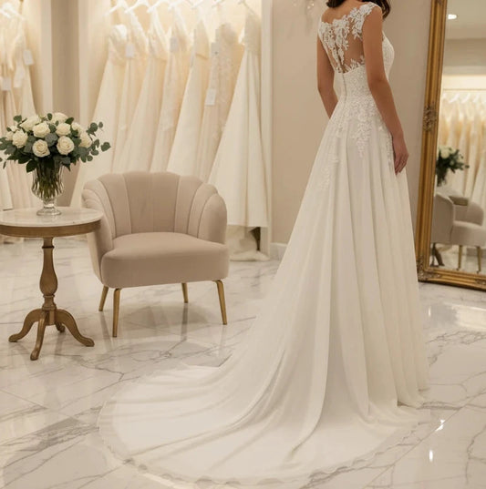 Ivory A-line organza wedding dress with lace bodice and flowing organza skirt