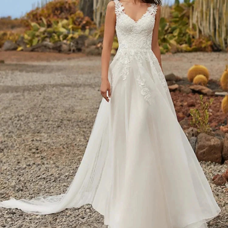 Ivory A-line lace organza wedding dress with V-neck bodice and embroidered skirt