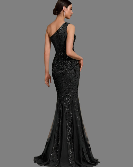 Black one-shoulder sequin mermaid dress, side view with fitted back and flared skirt