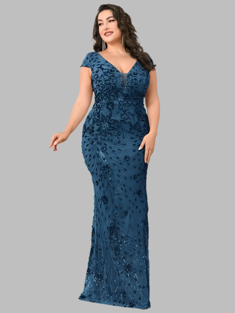 A woman in a plus size teal blue sequin evening formal party dress with cap sleeves