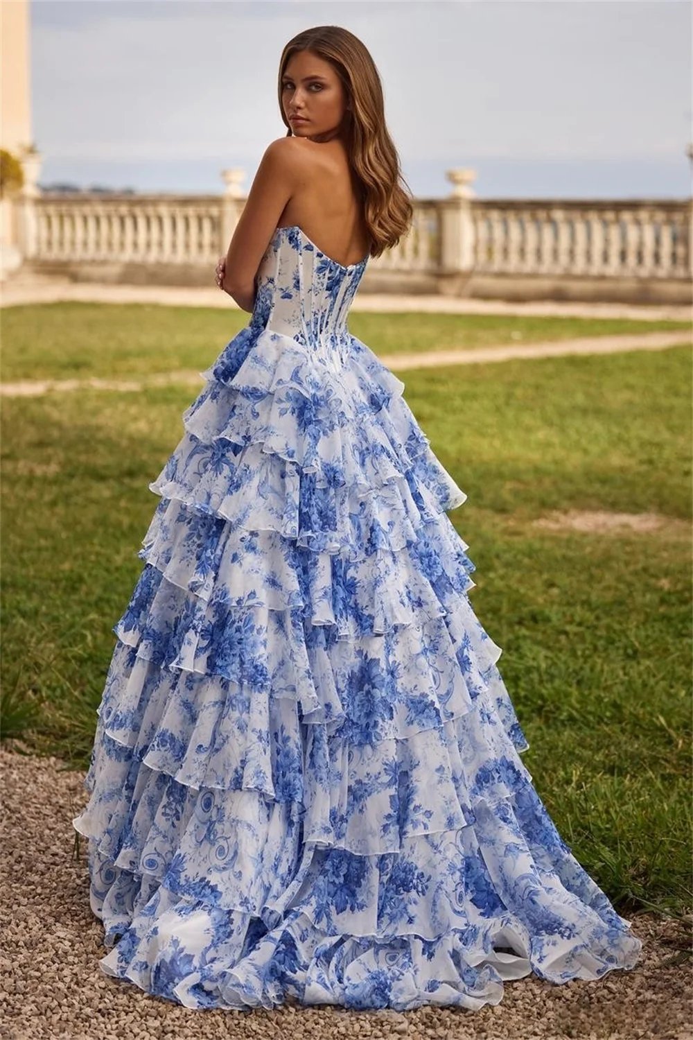 Floral Strapless open back floor length formal gown with ruffled sweep train