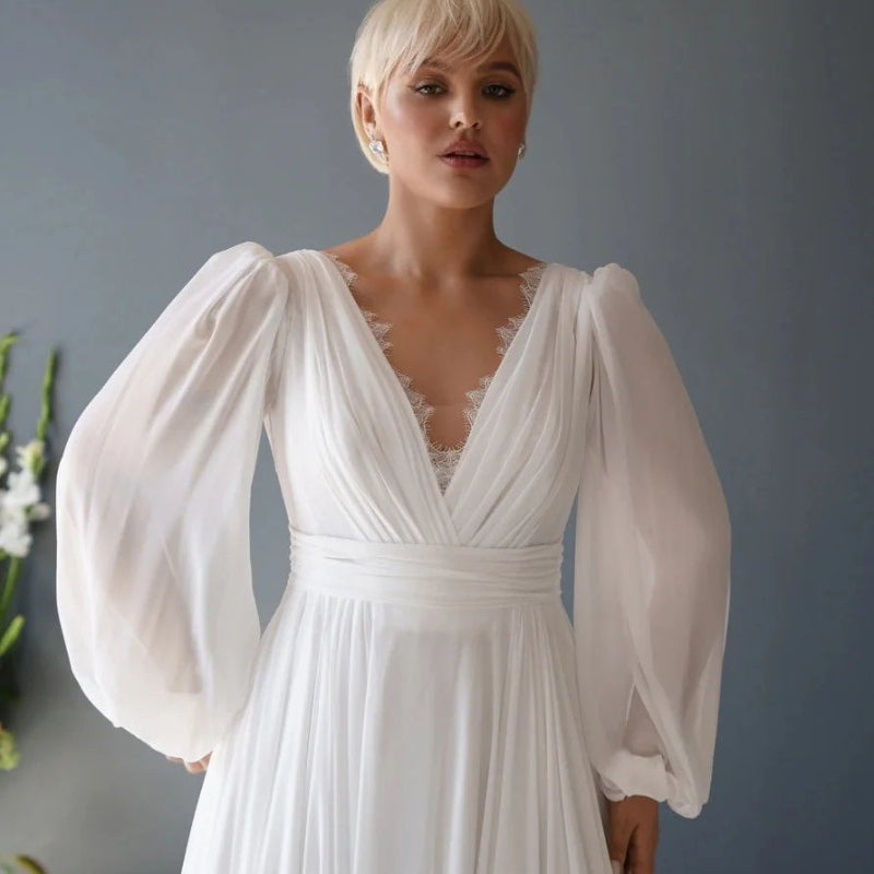 White chiffon v-neck wedding dress bodice with lace-trim neckline and oversized puff sleeves