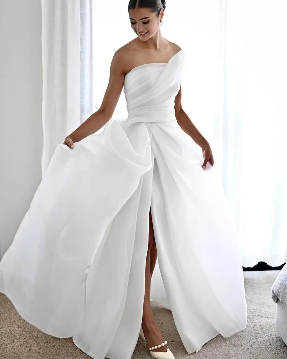 Ruched pleating strapless bodice made of gorgeous shining organza.White it ivory sizes 2-26w