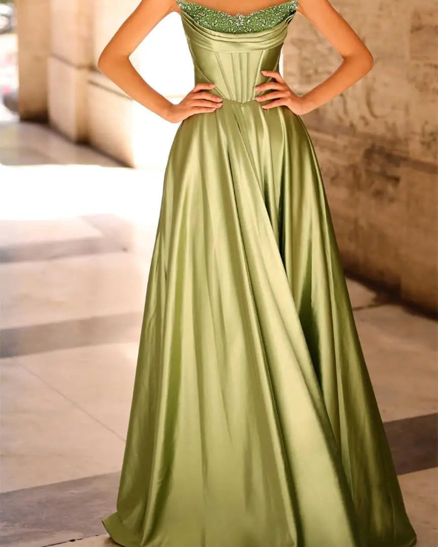Green strapless satin A-line evening gown with beaded neckline trim