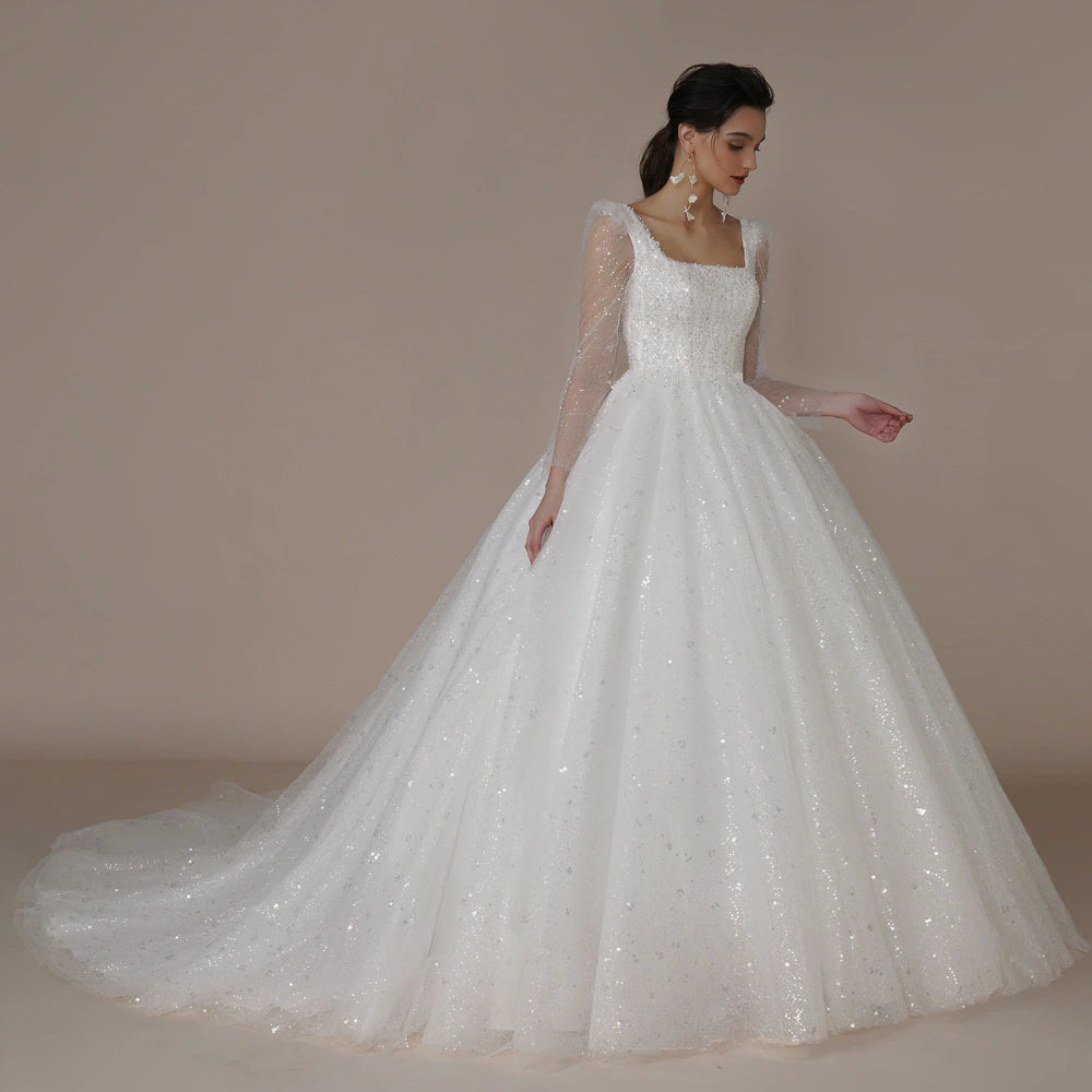 ivory beaded tulle and lace long sleeve princess wedding dress- formal elegance