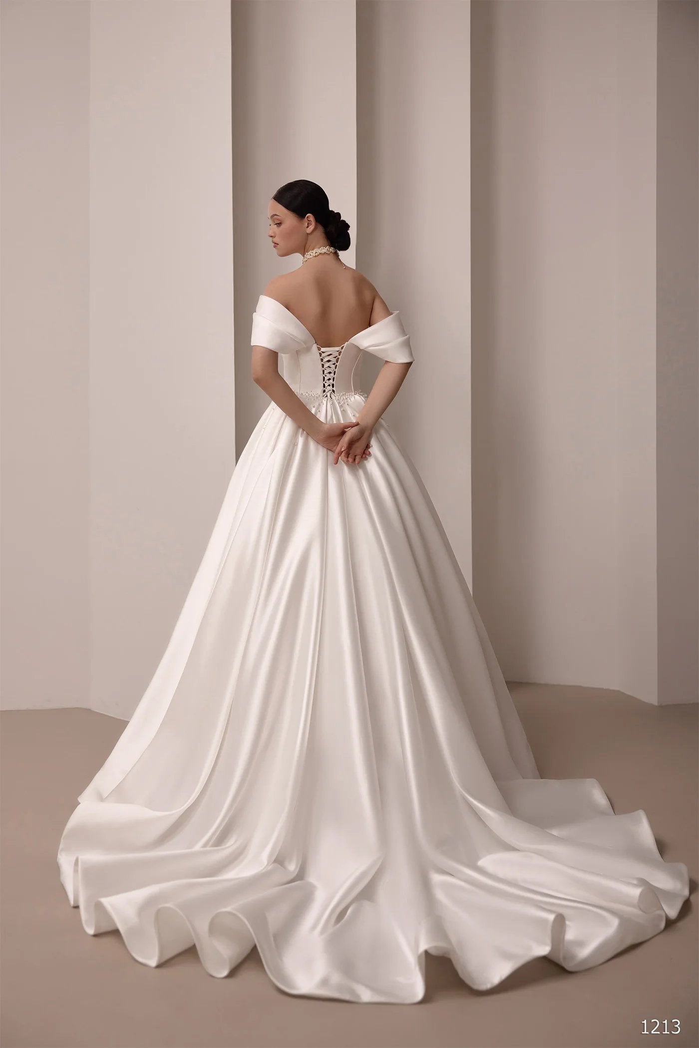 Lace up back off the shoulder satin bridal gown with a court length train
