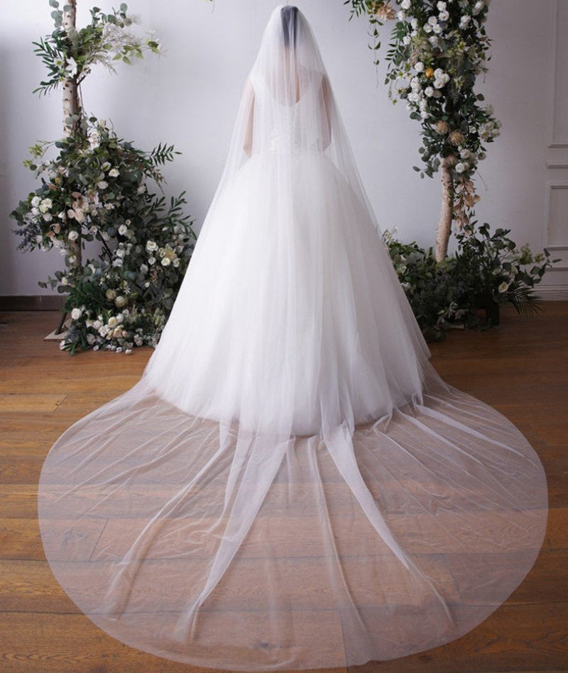Cathedral bridal veil in white sheer tulle with plain cut edge, full veil view