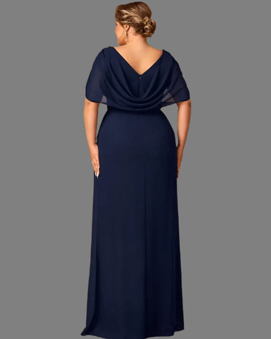 Navy blue evening gown with a draped neckline on a gray background