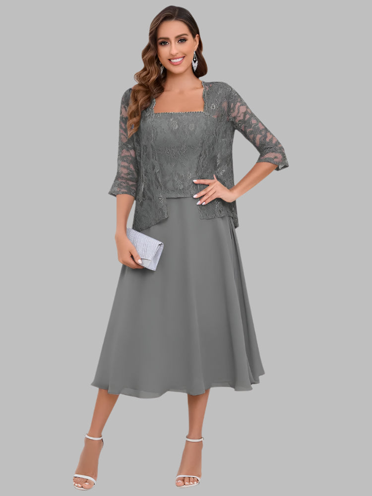 Woman wearing a grey chiffon dress with matching lace jacket for mother of the bride or groom