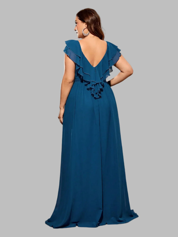 Woman wearing a blue evening gown with ruffled detail.