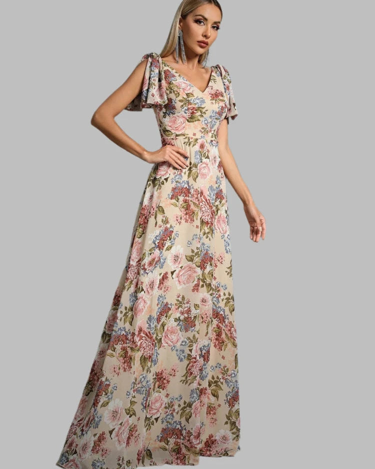 Floral chiffon maxi dress, side view, A-line silhouette, short puff sleeves.