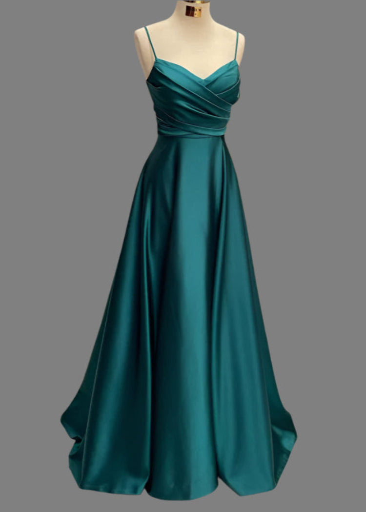 A floor-length satin A-line dress with spaghetti straps and a pleated bodice, displayed in an emerald green color.