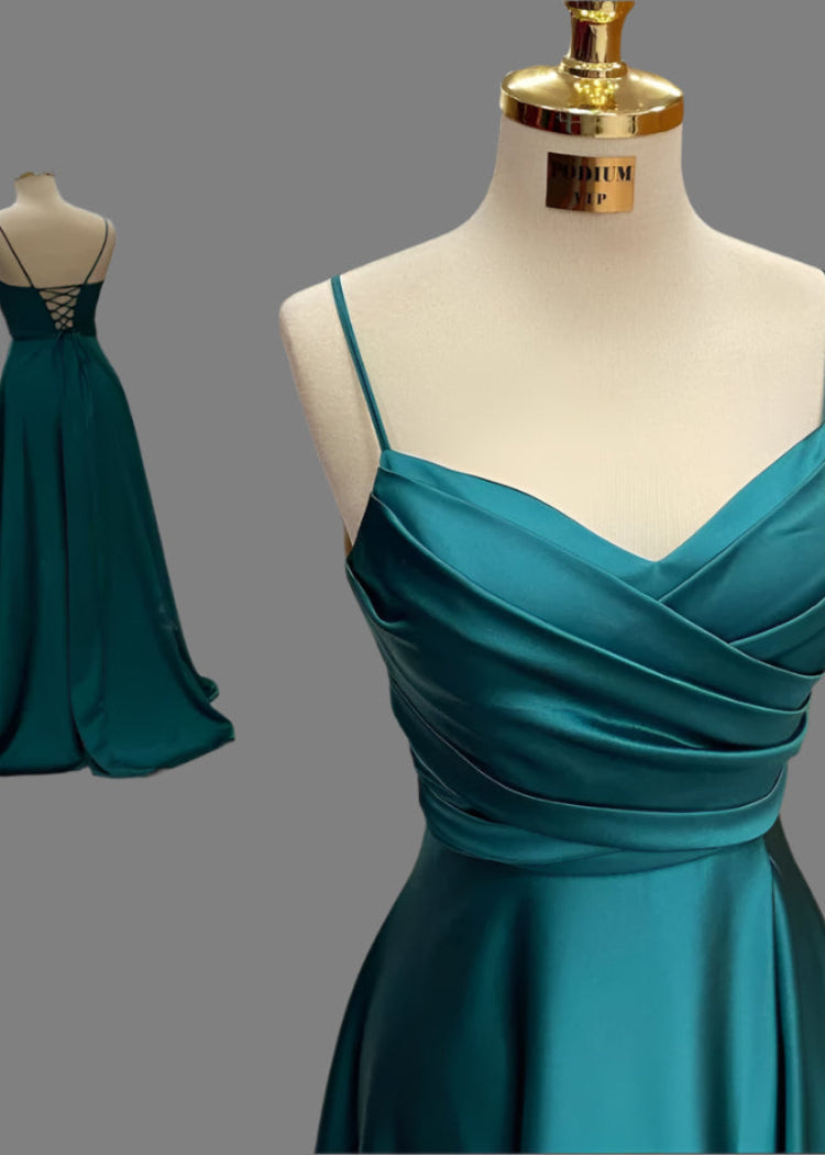 Teal dress on a mannequin with a gray background