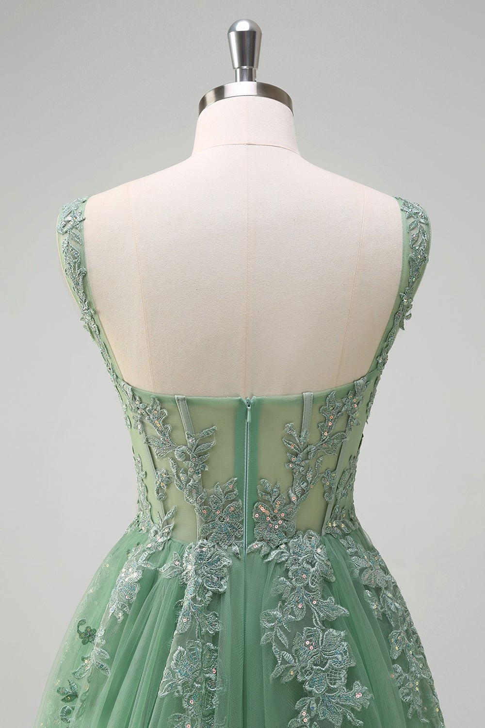 Green A-line lace tulle dress back view with lace appliques and waist seam