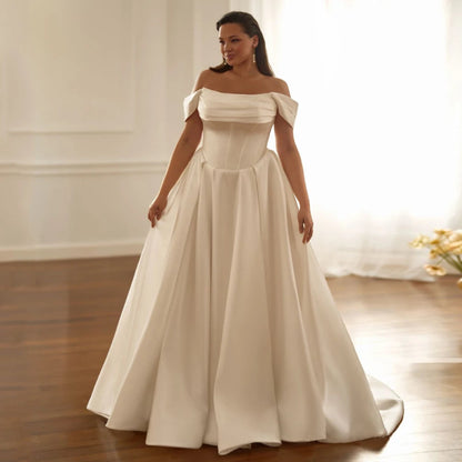 Ivory satin wedding dress, off-shoulder pleated bodice and full A-line skirt