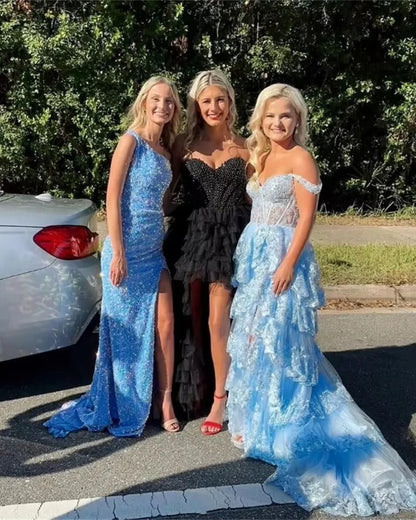 Blue sparkly lace formal gown with tiered ruffles and front leg slit