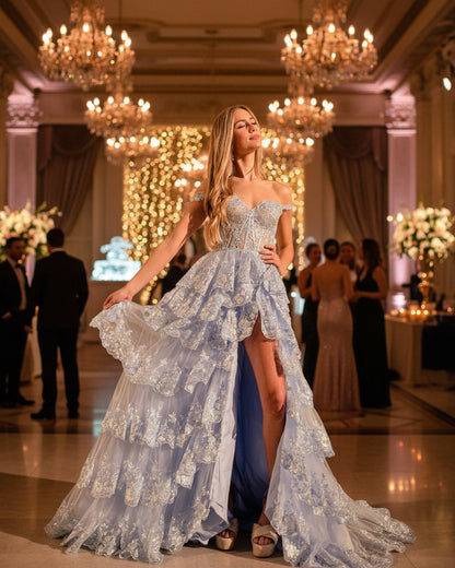 Blue sparkly lace formal gown with layered ruffle skirt and long flowing train