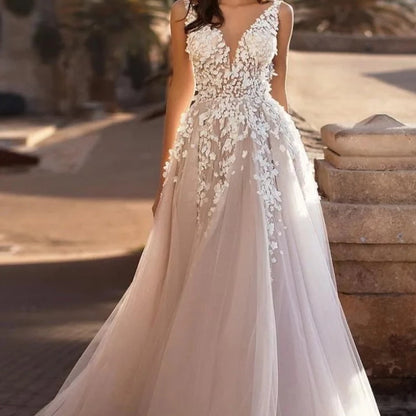 Ivory V-neck tulle wedding dress with floral lace bodice and full A-line skirt