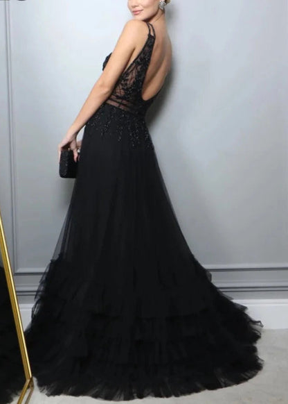 Black A-line evening dress, lace bodice with open back and flowing ruffled skirt