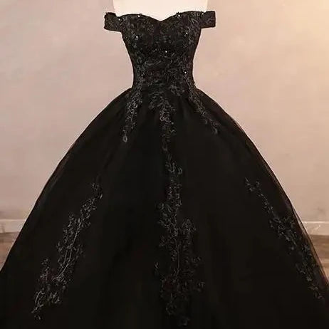 Off-shoulder lace ball gown with dark lace bodice and full skirt, black tone.