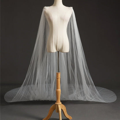 Ivory bridal cape veil with sheer tulle drape and floral crystal trim