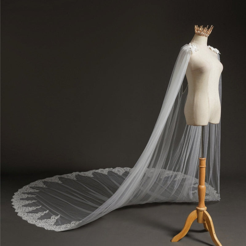 Bridal shoulder cape veil in sheer tulle with lace appliques and long draped train