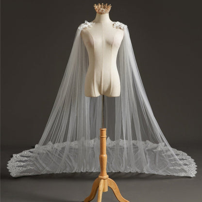 Bridal tulle cape veil with lace shoulder appliques and wide scalloped hem