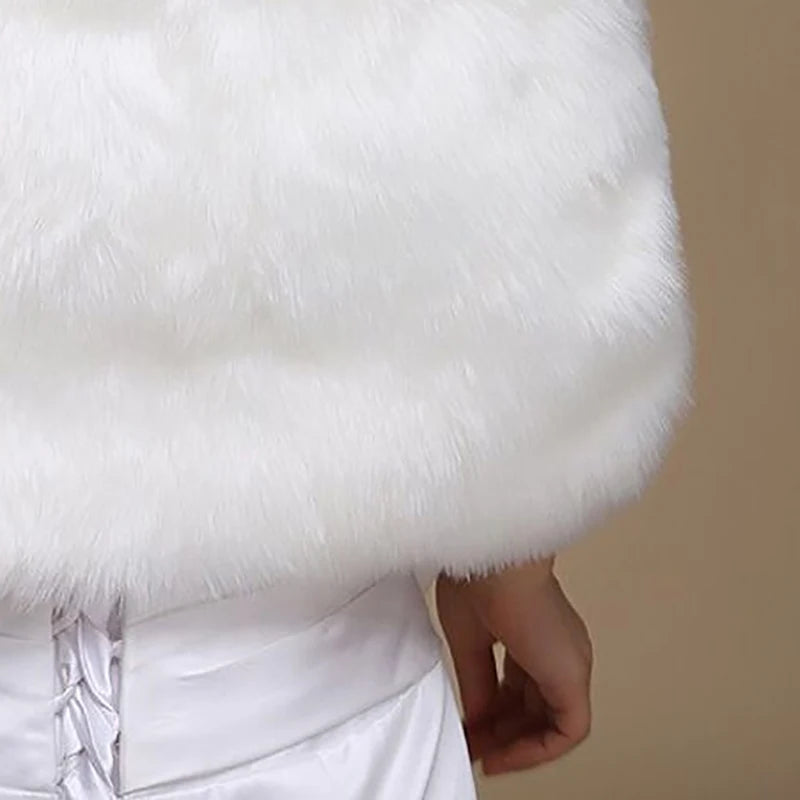 Off-white faux fur shawl close-up with soft pile and satin tie detail