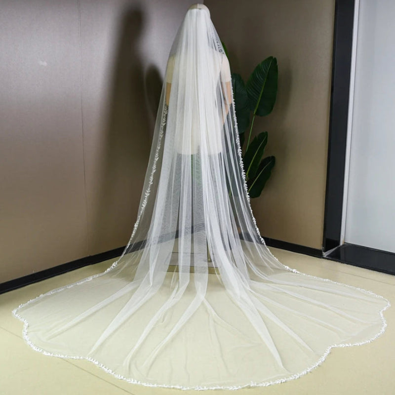 Single-tier cathedral wedding veil with lace edge, sheer tulle and scalloped trim