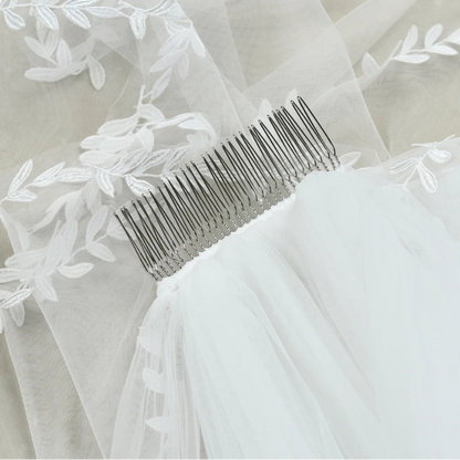 Lace edge wedding veil with comb attachment, white tulle and floral appliques