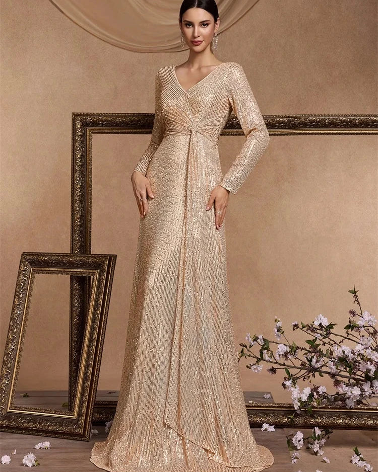 Champagne sequin sheath maxi dress with V-neck and long sleeves, draped waist