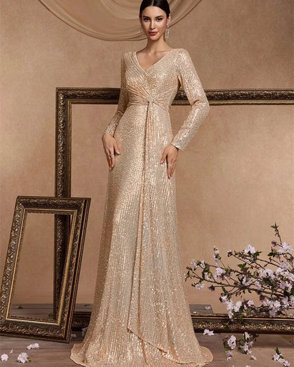 Champagne sequin sheath maxi dress with V-neck and long sleeves, draped waist
