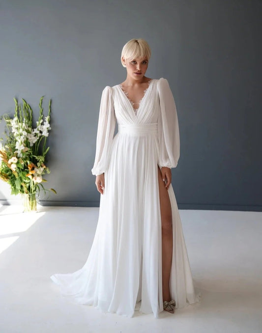 A-line chiffon fabric with a v-neck long puff sleeves and open back design. Floor length with sweep train wedding dress