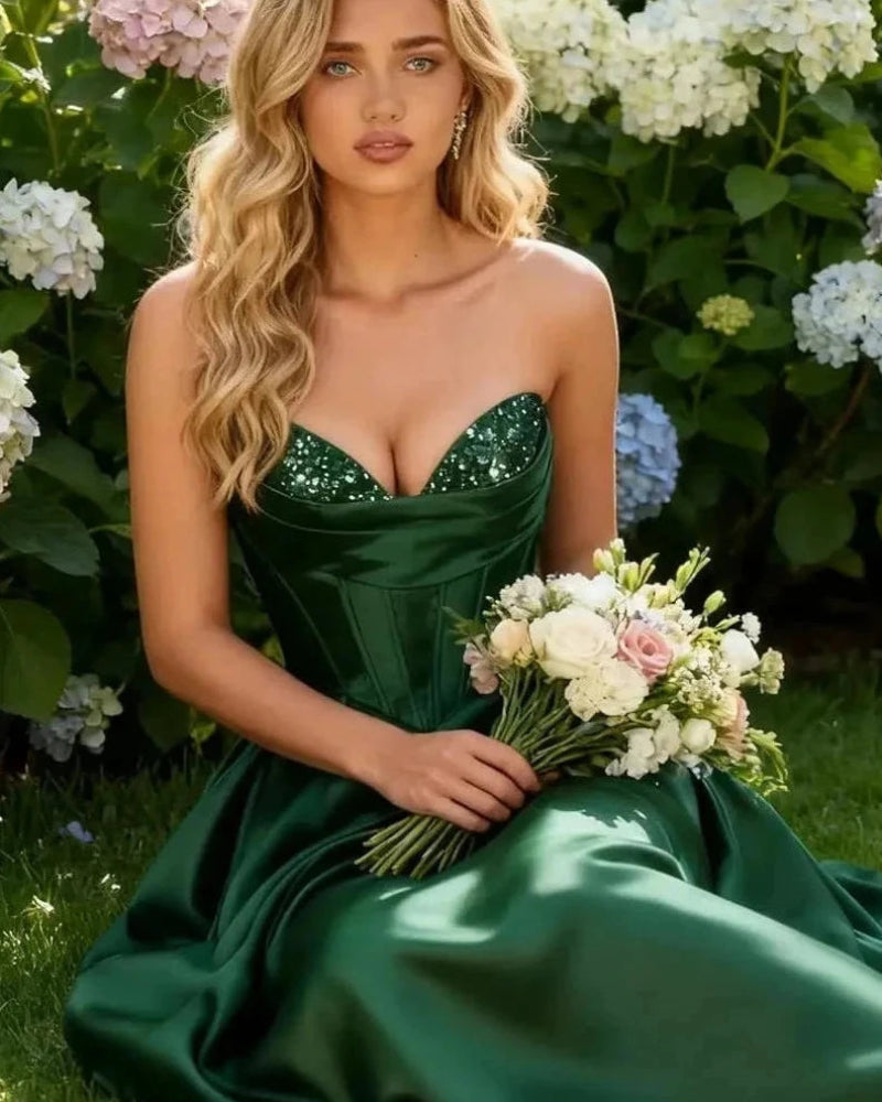 Strapless A-line satin dress with sequin bust and front slit, emerald green.