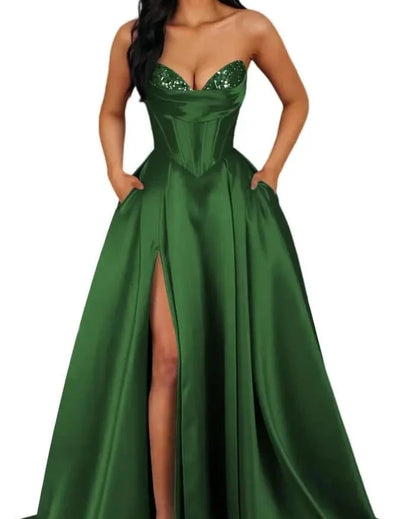 Emerald green strapless A-line satin dress with sequin bust and thigh-high slit