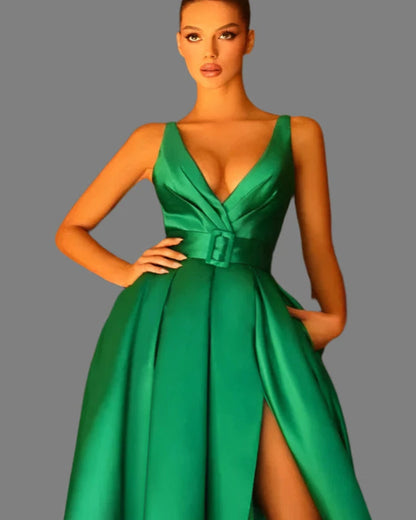 Emerald green satin v-neck evening gown with ruched waist detail and leg slit