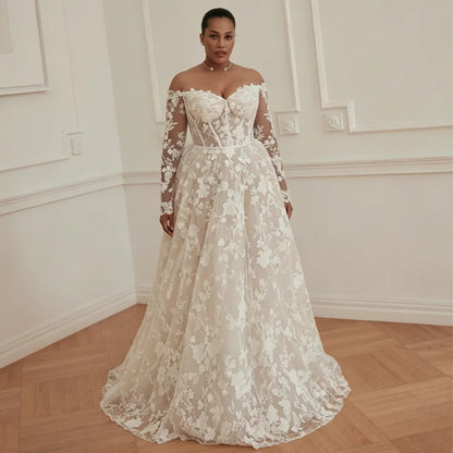 Off-shoulder lace wedding dress with sheer long sleeves, floral appliques, full skirt