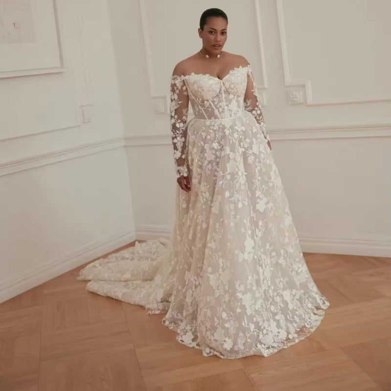 Off-shoulder lace wedding dress with sheer long sleeves and floral appliques, side skirt