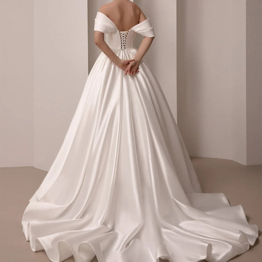 Lace up back off the shoulder satin bridal gown with a court length train