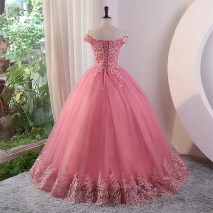 Off-shoulder lace ball gown with textured bodice and full A-line skirt, rose-pink.
