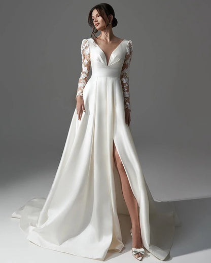 Ivory satin wedding dress with lace long sleeves, V-neck bodice, and thigh slit