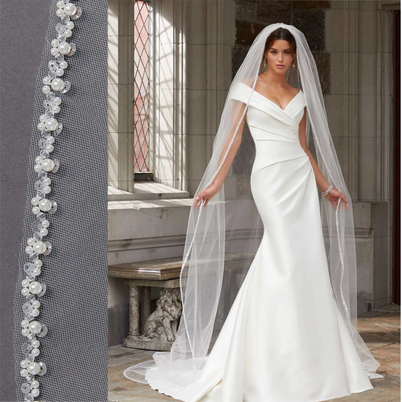 Ivory cathedral wedding veil with beaded edge, single tier, draped over shoulders