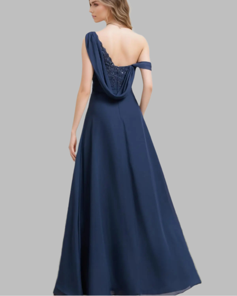 Navy one-shoulder chiffon A-line dress from the back with draped neckline and full skirt