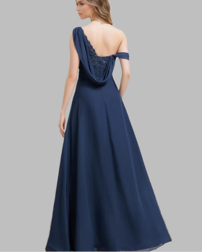 Navy one-shoulder chiffon A-line dress from the back with draped neckline and full skirt