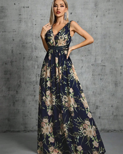 Navy floral chiffon maxi dress with sleeveless V-neck and flowing A-line skirt.