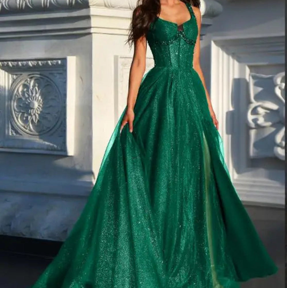 Emerald green A-line glitter tulle formal dress with wide straps and fitted bodice