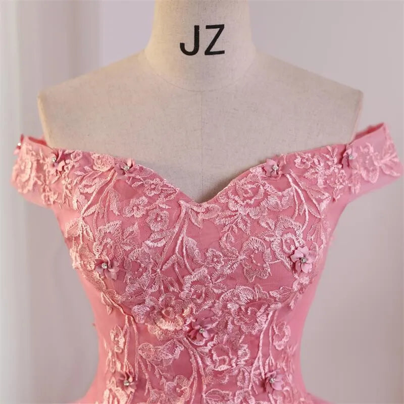 Off-shoulder lace ball gown bodice close-up with floral embroidery, rose-pink.