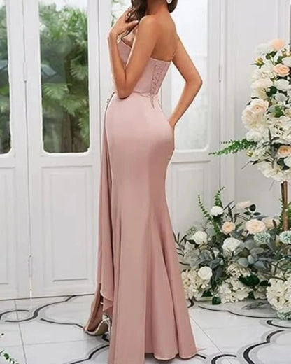 Pink satin mermaid gown with thin straps, sweetheart neckline, and front slit